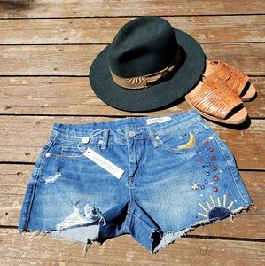 Embroidered distressed Jean shorts sun moon stars